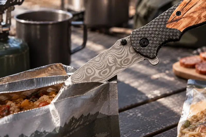 Folding Pocket Knife — Crowded Camp Table